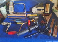 All tools laid out on blue cloth surface
