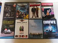 Eight DVD cases including Late Fragment, Make It Funky!, Superbad, The New 3 Stooges, Somewhere, Ghost World, Tideline, Drive