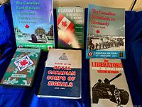 Overview of all six items: five books and one DVD case