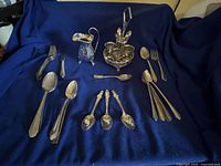 All items in lot laid out on blue cloth