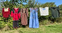 All six garments hanging on line, full frontal view