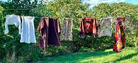 Six garments on clothesline showing full lot