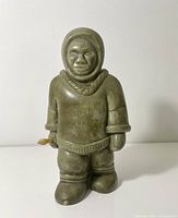 Front view of soapstone Inuit statue standing upright
