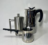 Full view of three stainless coffee items