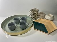Group shot of entire lot showing tray, cups, mugs, Hay trays and candle holders
