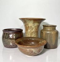 Group shot of four pottery pieces