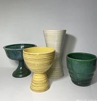 Group shot of all four pottery pieces