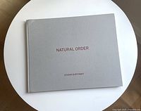 Front cover showing grey cloth boards with title and author