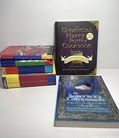 All six books arranged, showing covers and spines