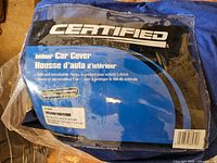 Front label of Certified indoor car cover package showing brand and product information