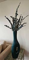 Tall teal vase with faux eucalyptus stems