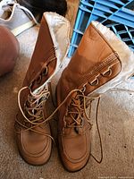tan lace-up shearling-lined boots standing upright