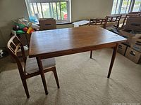 Table and one chair shown, no leaves inserted, provides view of overall style and condition