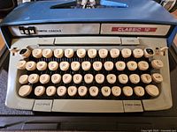 Front view of Smith-Corona Classic 12 keyboard and branding