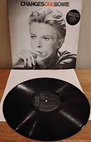 Front jacket showing David Bowie portrait and vinyl record Side 1 label