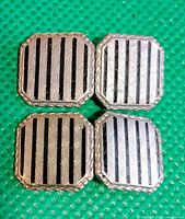 Four octagonal cufflink faces showing stripe design