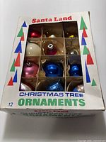 Box cover showing Santa Land branding and visible ornaments
