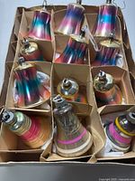 Box with 12 glass bell ornaments in cardboard divider