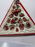 Overall view of triangular tray holding miniature wooden ornaments
