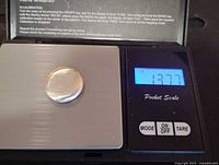 Nugget on digital pocket scale displaying 13.77 g