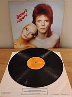 Front sleeve artwork and vinyl record with orange RCA label