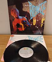 Front of LP jacket opened with vinyl on display