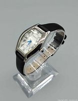 Angled view of the Geneva quartz wristwatch showing case shape, dial, and strap