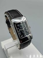 Front angle of quartz wristwatch showing case, dial, strap