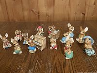 Full group of Pendelfin rabbits and piano