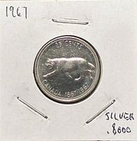 Reverse view showing bobcat design and dates 1867-1967