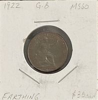 Obverse side of 1922 GB farthing in holder showing handwritten details
