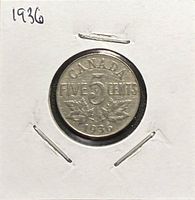 Reverse of 1936 Canadian 5 cents showing denomination, maple leaves and date