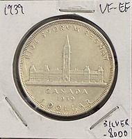 Reverse of 1939 Canadian silver dollar showing Parliament Buildings and date