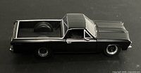 Left side view of black 1963 Chevrolet El Camino die-cast model