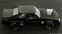 Left side profile of black 1:24 Ford Falcon XB model showing wheels, side exhaust, blower