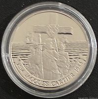 Reverse of 1984 Jacques Cartier commemorative proof dollar in capsule