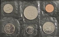 Front view of sealed 1985 proof-like coin set showing six coins