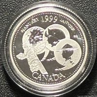 Reverse of 1999 January Millennium silver proof quarter in capsule