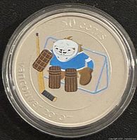 Reverse: colour depiction of Quatchi goalie, denomination 50 cents visible