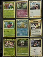Front view of nine Pokémon cards in binder page
