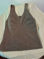 Front view of taupe ribbed cashmere sleeveless top