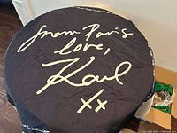 Full view of scarf showing central script motif