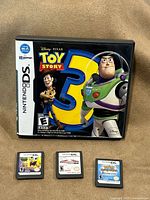 Front view of Toy Story 3 DS case with all four cartridges displayed