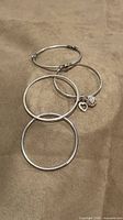 Group shot of four sterling bangles