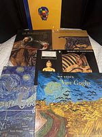 All seven books laid out showing covers