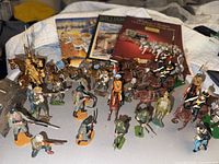 Group shot of all hand-painted soldiers, horses, mules and three catalogs