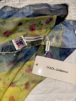 Scarf showing overall pattern, hanging brand tags