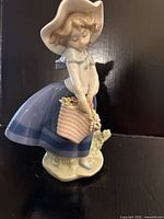 Front angled view of Lladro Pretty Pickings figurine