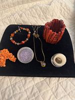 Overview of all jewellery pieces on black pad