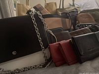 Group shot showing all handbags and wallets